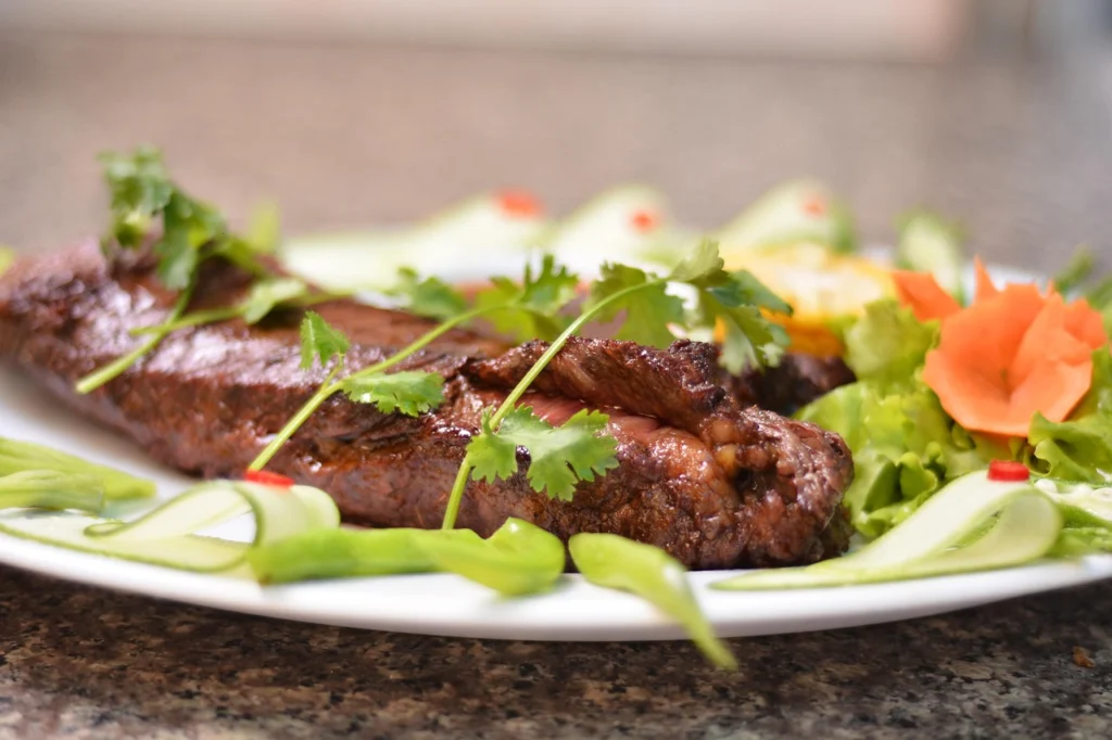 Beef cubes browning in a hot cast iron skillet, building flavor for stew