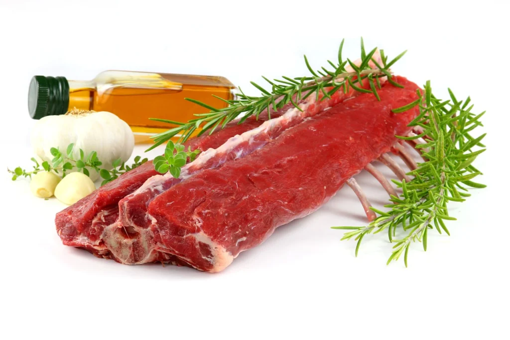 Raw lamb shoulder cubes on cutting board ready for browning