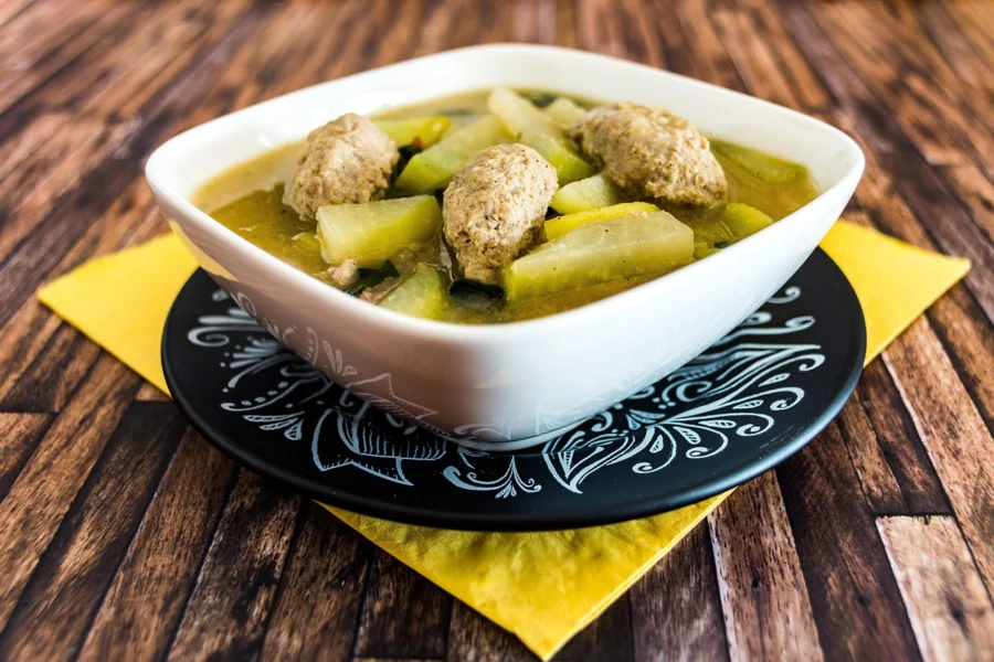 Serving bowl of slow cooker lamb stew with bread